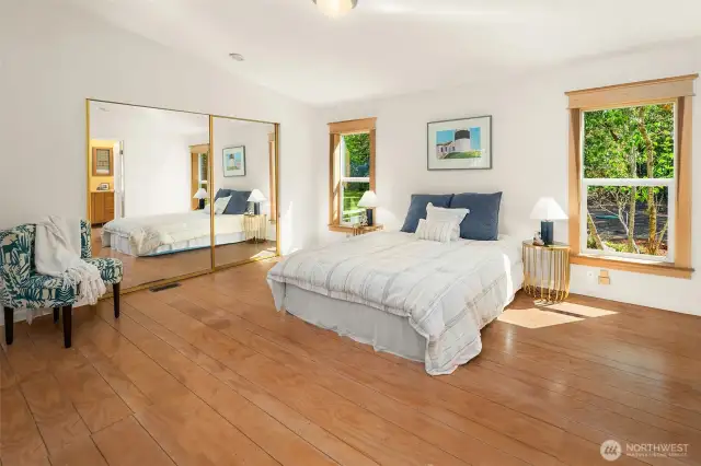 Primary bedroom is generous, with room for a private sitting area or workspace.