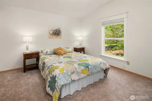 Second bedroom freshly painted with new carpet.
