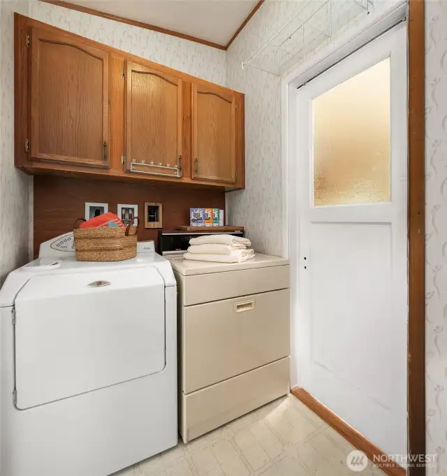Laundry is right off the back door near the kitchen.