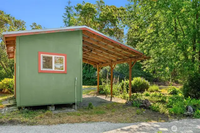 Storage shed with carport.