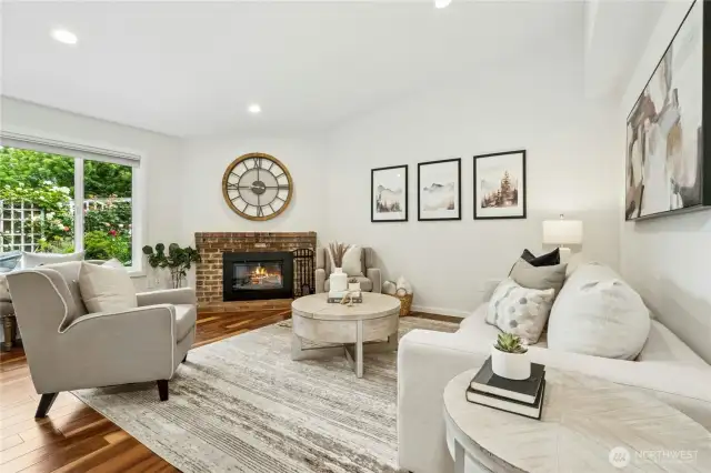 Pretty brick fireplace with high-end electric insert. No wood to store!!