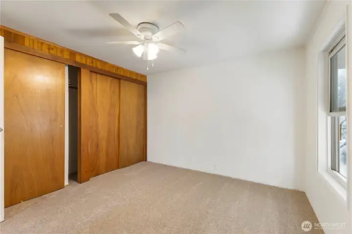 Second bedroom has ample closet space, ceiling fan & attached full bathroom.
