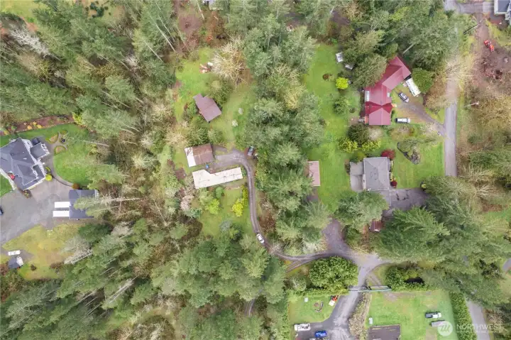 This property presents immediate income potential for investors or a cozy starter home for buyers or consider the opportunity to remove the existing home and build your dream home in this serene setting.