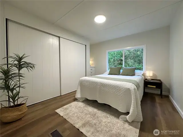 Primary bedroom with built in vanity and huge closet
