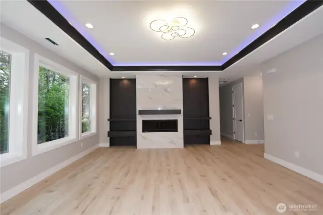 The living room has four huge windows to bring in lots of light