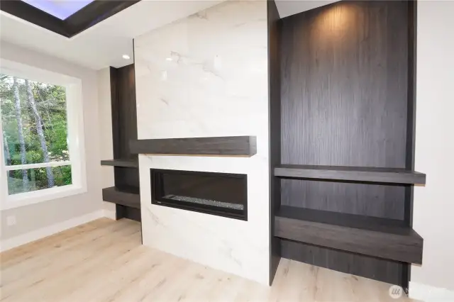 The fireplace, matle, and shelving is a great place for your treasures!
