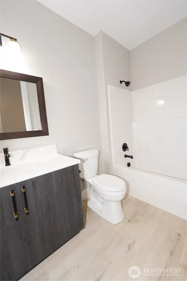 The hall bath has beautiful finishes.