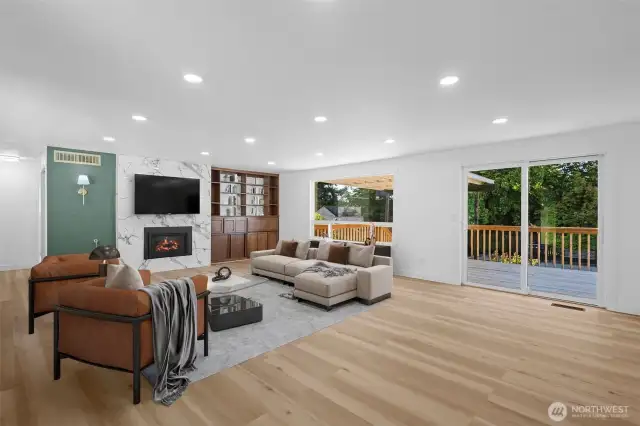 Virtually staged. Comfortable gathering space for residents, family, or guests. Sliders lead to the sizeable deck.