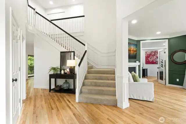 Step inside through the impressive double-door entry into a dramatic two-story foyer.