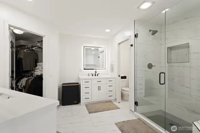 Large format tiled floor and large walk-in closet.