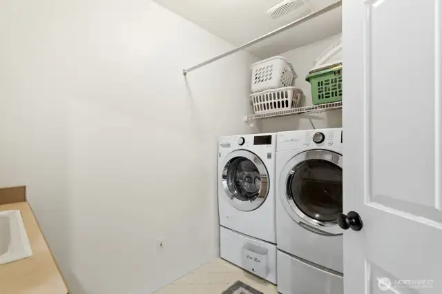 Laundry room with a sink conveniently located upstairs.