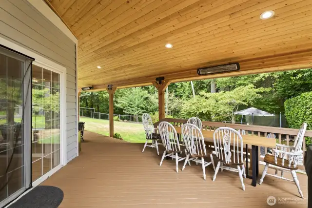 The large covered exterior deck features 3 skylights, heaters and recessed lighting.
