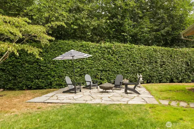 A flagstone patio in the yard to enjoy sunny afternoons.