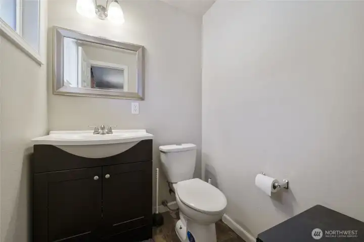Enjoy a 1/2 bath off of the primary bedroom