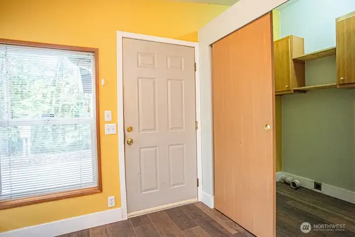 Door from Kitchen to garage.  Laundry room/closet to the right