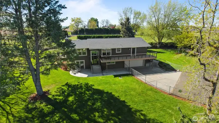 The park-like grounds are tidily landscaped and feature beautiful shade trees and an app-controlled smart sprinkler system.