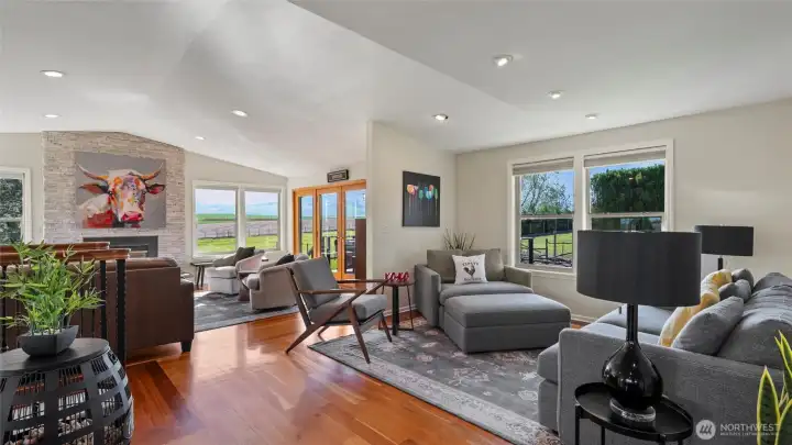 The open great room offers cozy hang-out spaces to gather and take in the views and bucolic vibes.