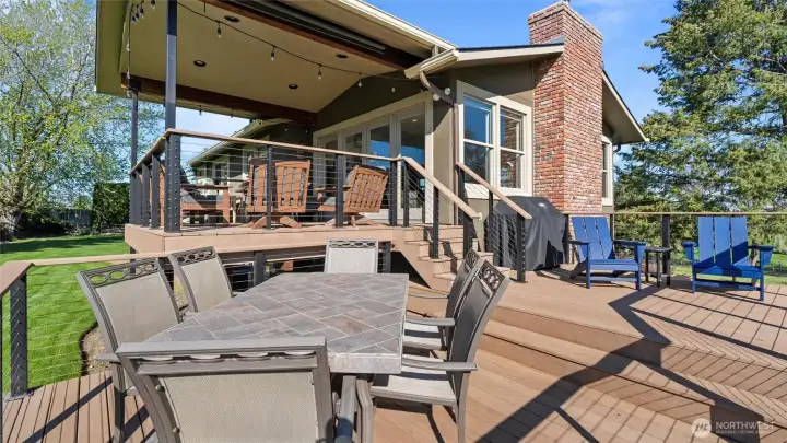 The tri-level deck invites you to lounge and play in the sunshine. The "middle" deck is plumbed for a grill or gas fire pit.