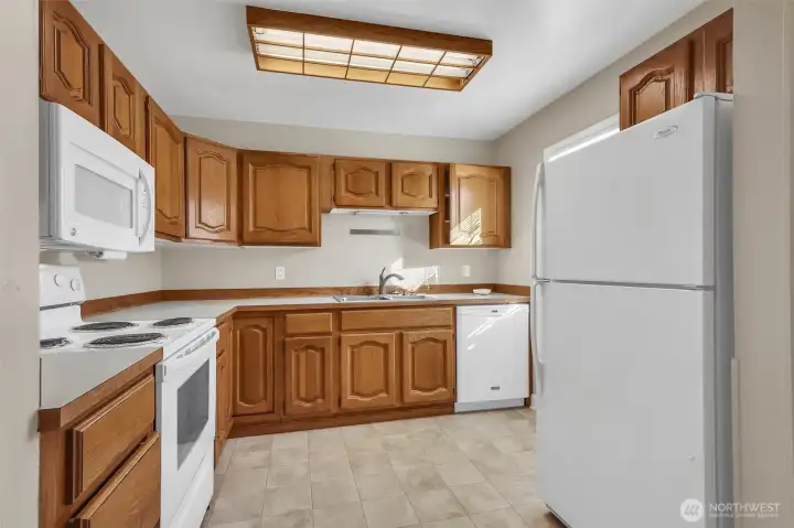 Efficient kitchen with ample cabinetry and storage.