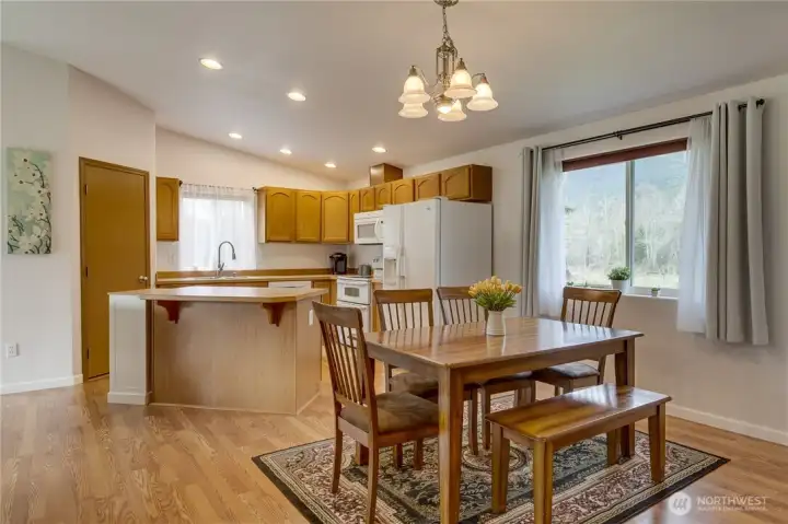 Efficient kitchen storage and workspace, open to the dining area.