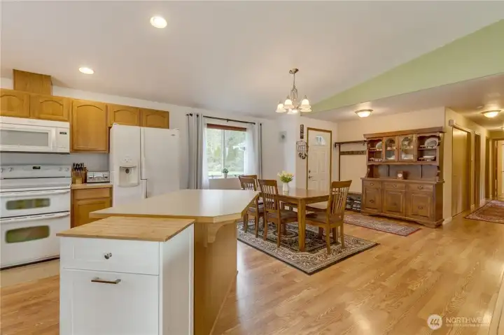 The hallway on the right of this photo provides access to the 3 bedrooms, 2 bathrooms, laundry/mud room, and the attached garage.