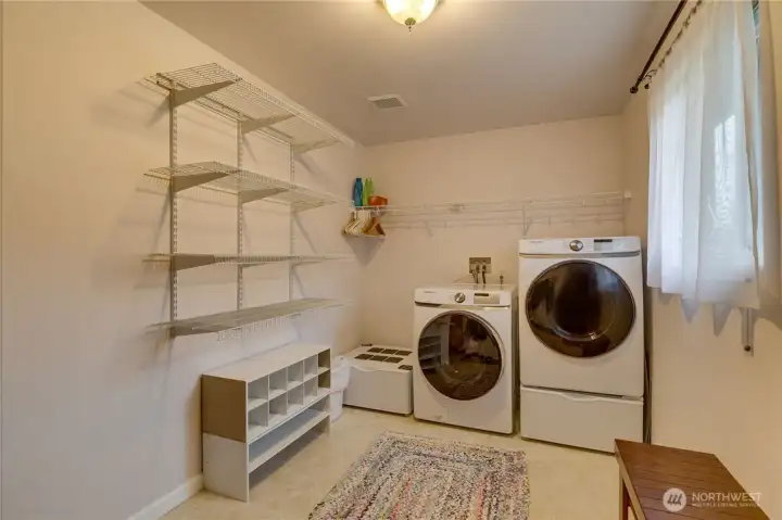 Convenient laundry and mud room. Entrance to attached garage is to the right (not shown).