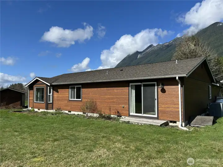 This photo shows the sliding doors providing outside access from the primary bedroom.
