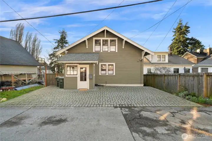 The parking pad was leveled with new pavers installed so there is parking for 3 cars!