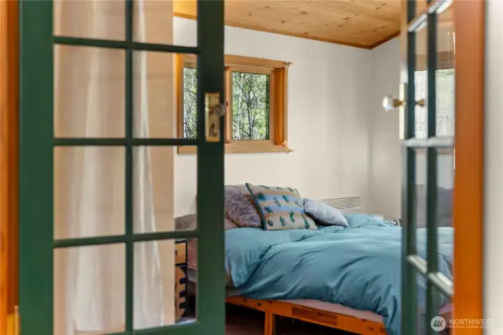French doors lead to the main floor bedroom.