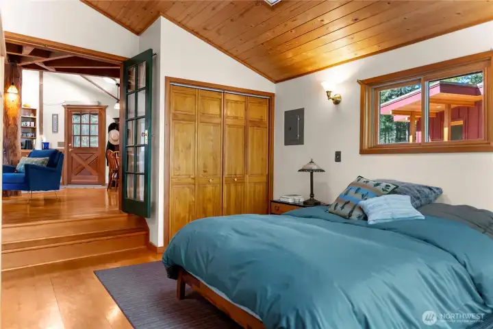 The bedroom has a large closet for clothes and storage.