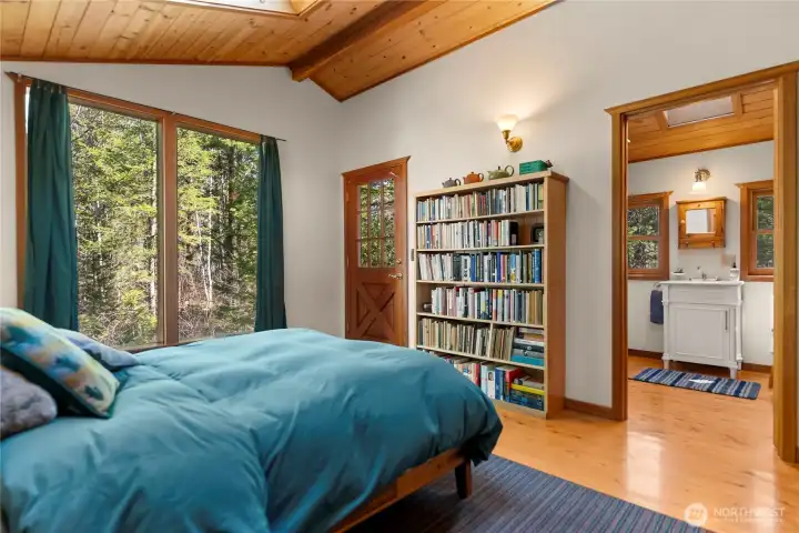 The bedroom has an exterior door that leads to a small back porch.