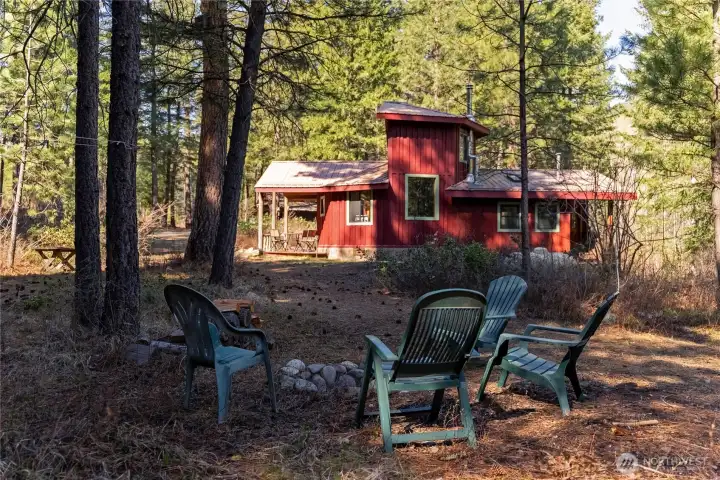 The level property offers lots of sitting spaces, including a nice firepit for seasonal gatherings.