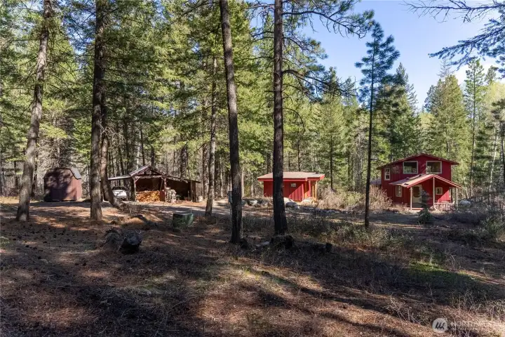 The property's buildings are accessed from a gravel turnaround.