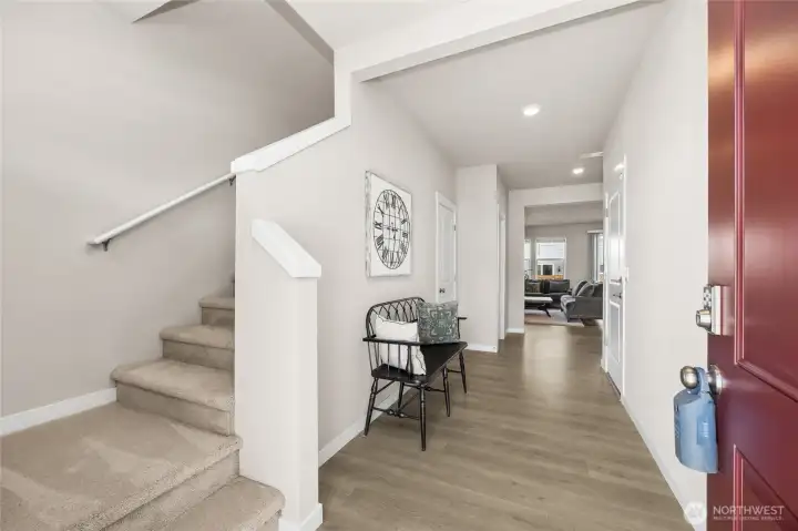 Inviting, wide entryway. Home is staged.
