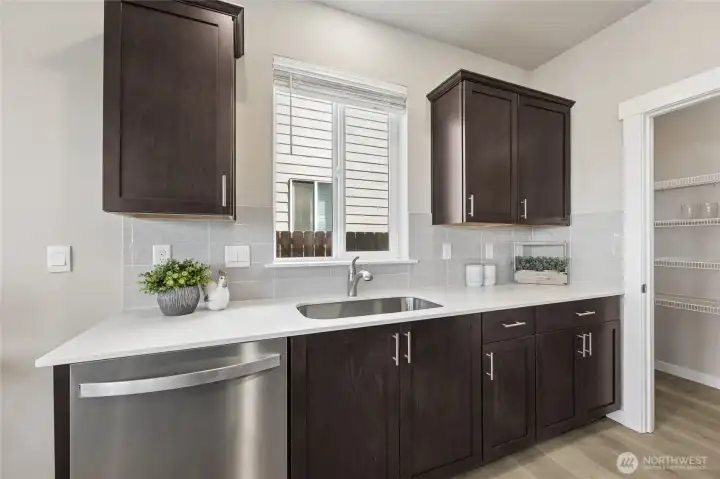 Quartz countertops. Home is staged.