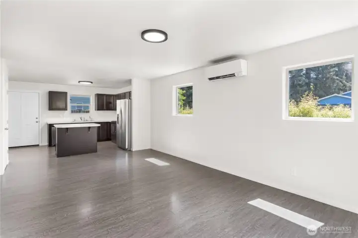 Open-concept design. The door off the kitchen is to the backyard.