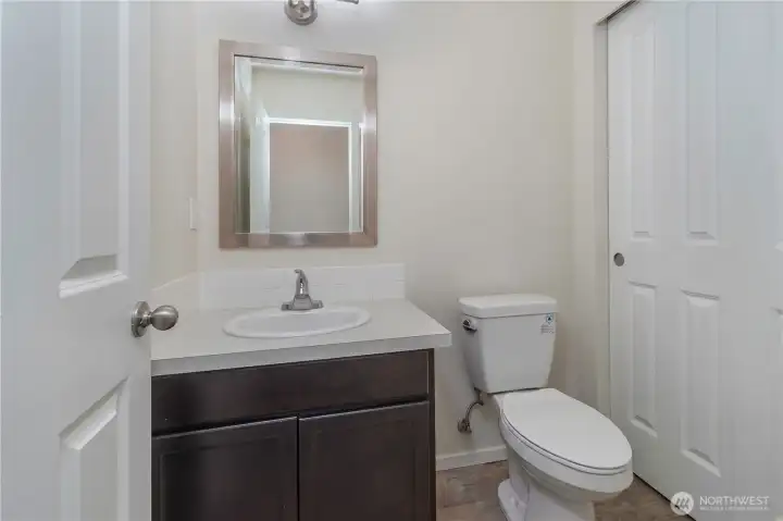 Main level powder room with a HUGE storage closet!