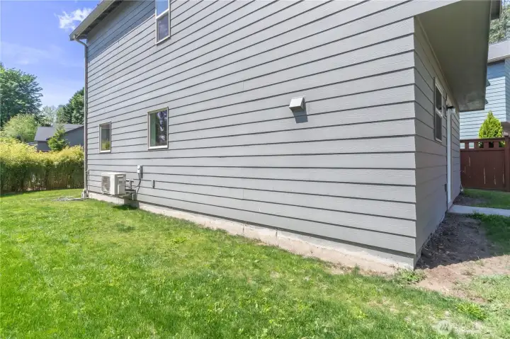 Sunny side yard would be perfect for a small flower or vegetable garden.