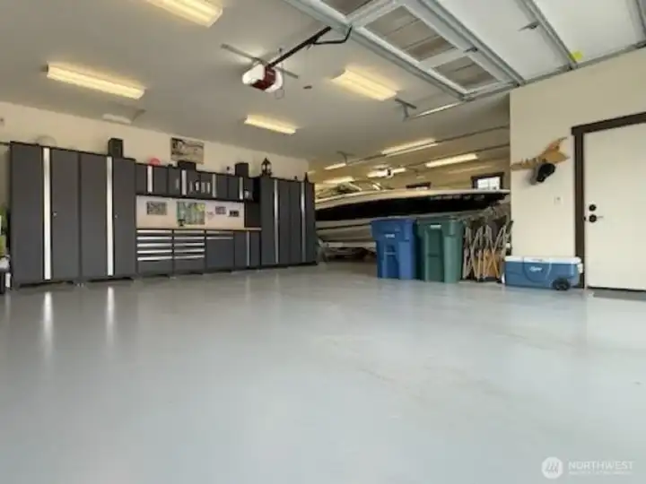 Spacious 3-car garage with dedicated shop space.