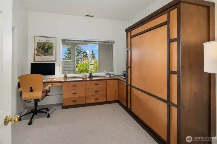 4th Bedroom downstairs with built-in deck and Murphy Bed for office/private guest suite flexibility!