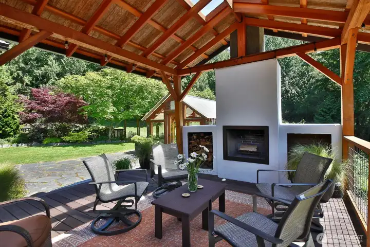 Located off of the main living area of the home, this timber frame Cabana, built from Cedar and Fir milled from the land, is a sweet spot to sip your morning cup of coffee or to light a fire and watch the colorful hues of the setting sun. Perfect for entertaining yet also cozy enough for a party of two. Located off of the main living area of the home, this timber frame Cabana, built from Cedar and Fir milled from the land, is a sweet spot to sip your morning cup of coffee or to light a fire and watch the colorful hues of the setting sun. Perfect for entertaining yet also cozy enough for a party of two.