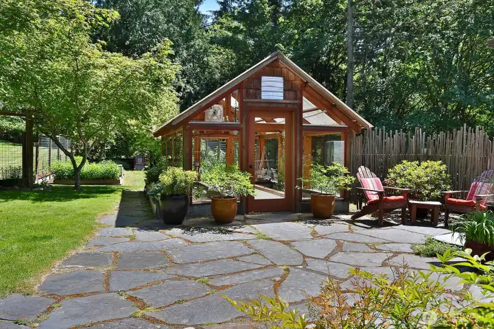 Also built from Cedar and Fir from the land, this Timber Frame Greenhouse is steps away from the Cabana (just beyond the right edge of this photo) and is adjacent to the raised garden beds. With ventilation and irrigation, the greenhouse is a great place for your starts or exotic plants. Also built from Cedar and Fir from the land, this Timber Frame Greenhouse is steps away from the Cabana (just beyond the right edge of this photo) and is adjacent to the raised garden beds. With ventilation and irrigation, the greenhouse is a great place for your starts or exotic plants.