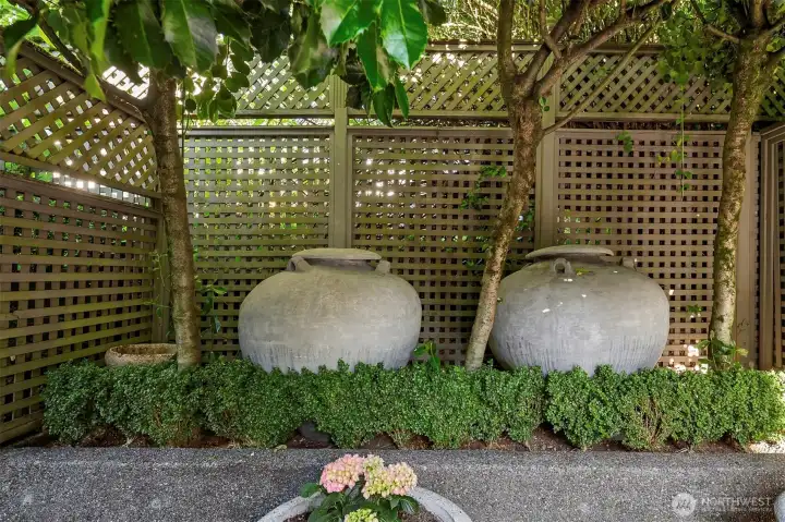 Large urns displayed above the private patio Large urns displayed above the private patio