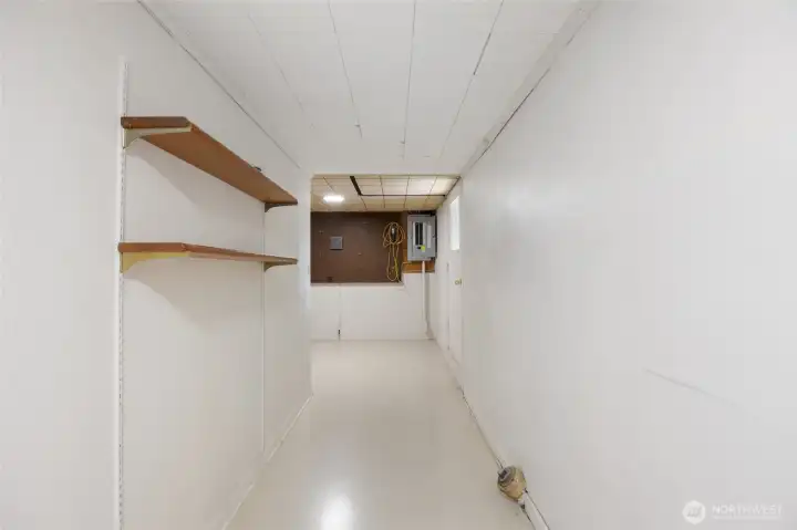 Storage Room in basement with door to backyard Storage Room in basement with door to backyard