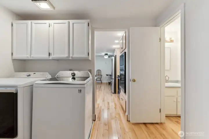 Storage and 1/2 bath in this laundry room.