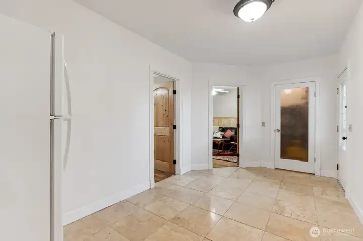Huge bonus room that accesses both utility room and large wood deck and 2nd & 3rd bedrooms & 2nd pantry.