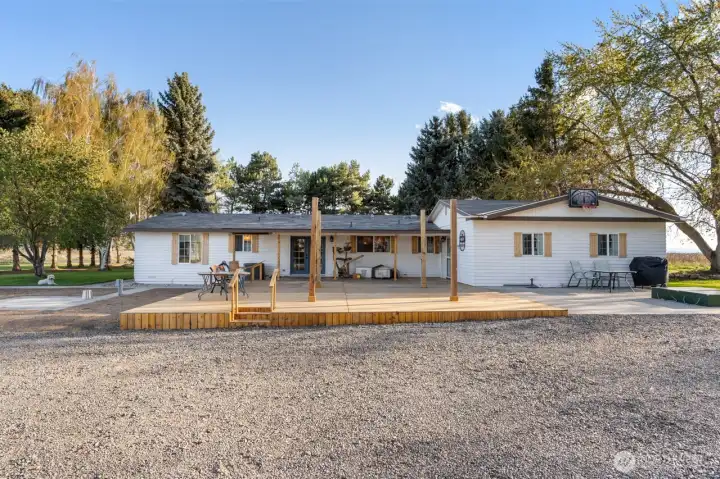 Deck includes kite & electric posts for outdoor kitchen/dining.  Hot tub pad & 220 just off deck.