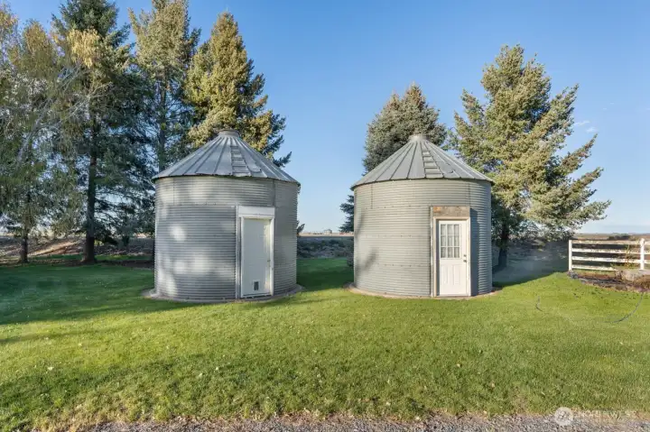 2 steel silos with concrete pads