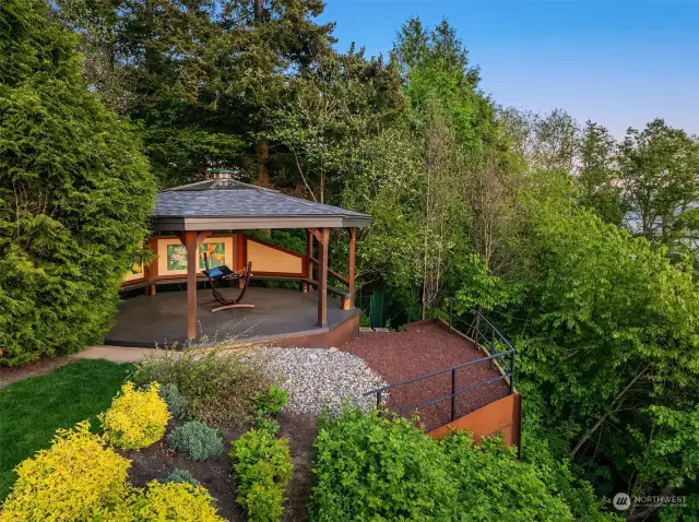 Gazebo offers covered seating for year round enjoyment of the beautiful landscape and watching nature.