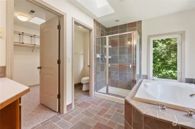 Master bathroom features walk-in closet, soaking tub/separate shower.